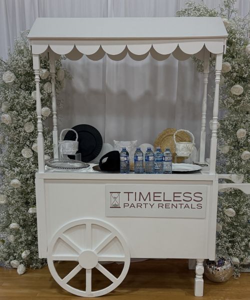 Timeless Party Rentals Candy Cart Setup White With Flower Arch