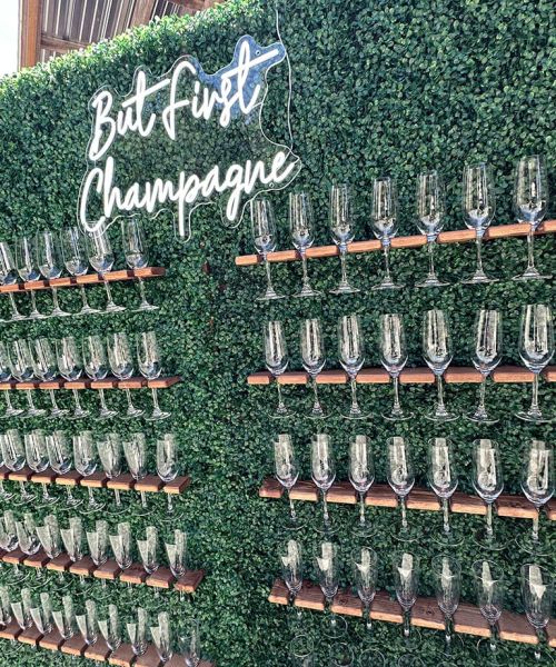 TImeless Party Rentals 'But first champagne' glass display at event