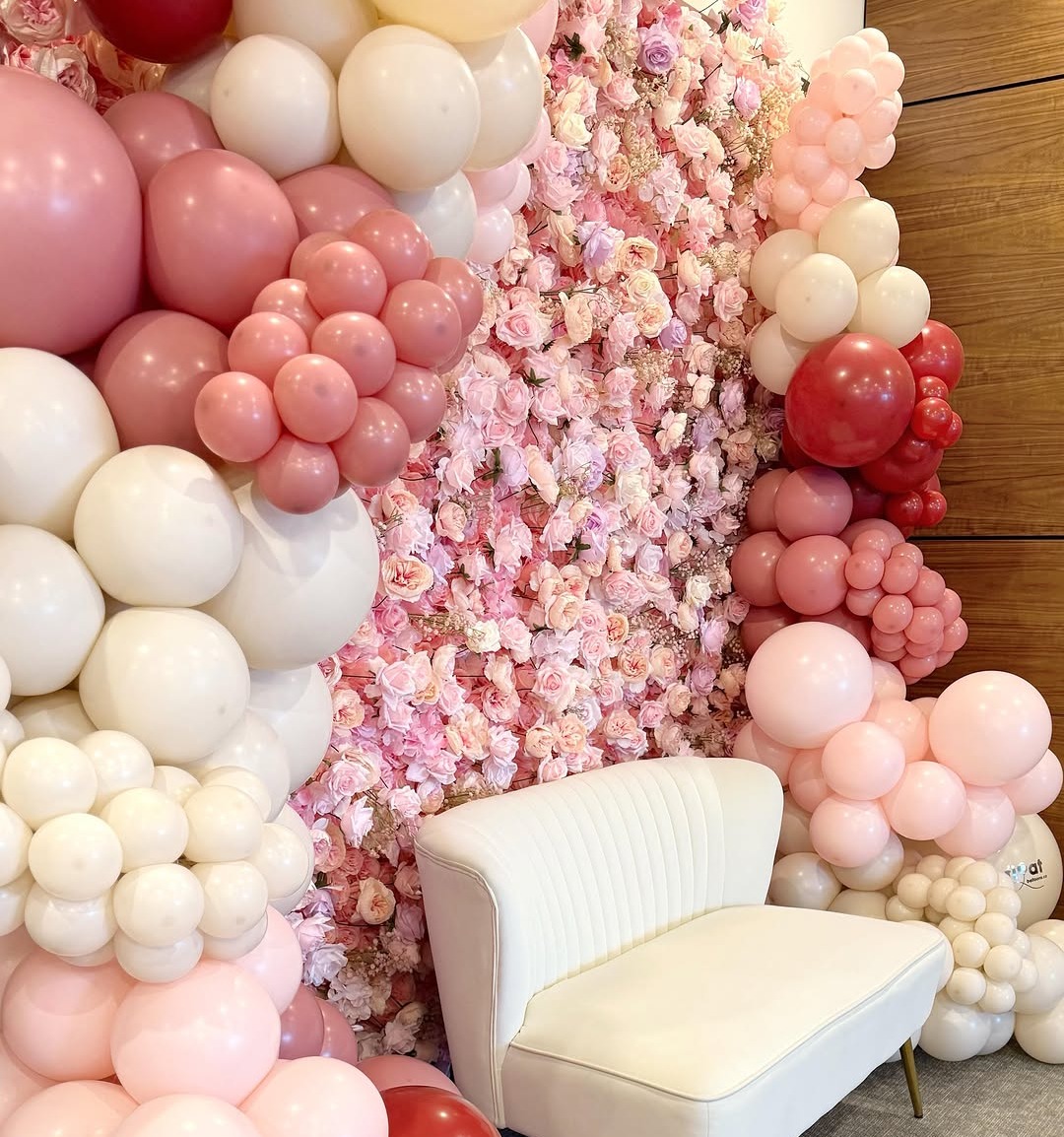 Pink Flower Wall Backdrop with White Couch