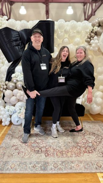 Timeless Party Rentals contact image staff laughing, photo taken at a wedding show